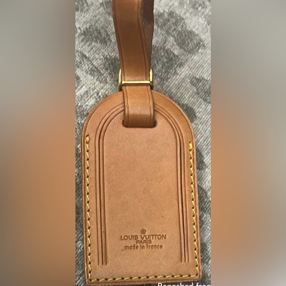 Vintage Louis Vuitton luggage tag.